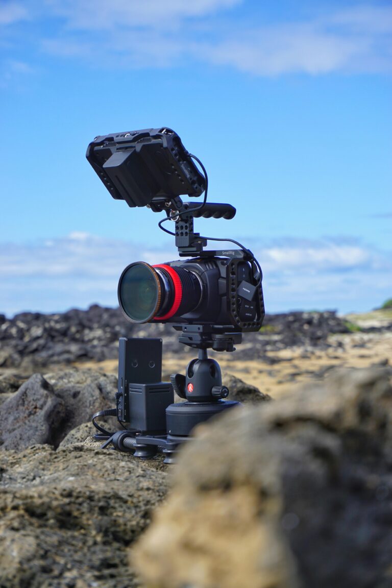 High-resolution camera on rocky beach in Hawaii, perfect for videography.